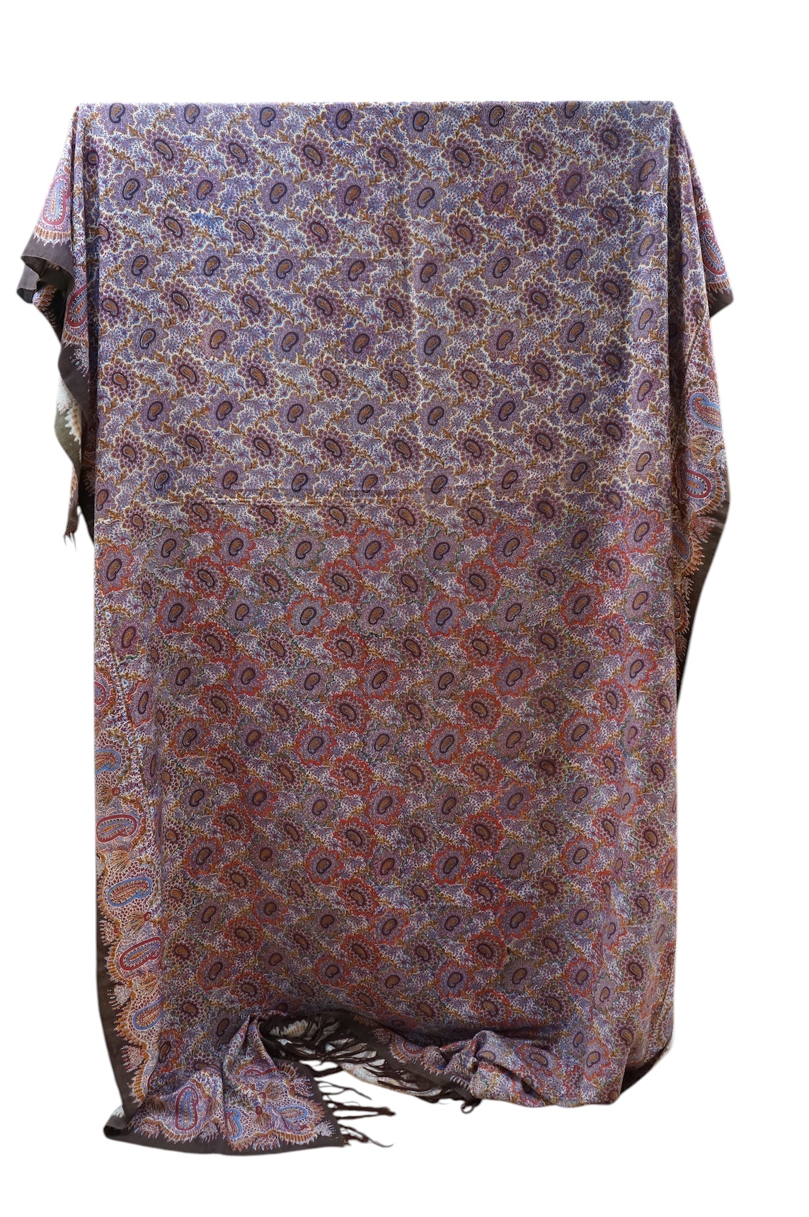 A 19th century printed Paisley summer shawl and an American ‘Log’ patterned patch worked table cover. Cover 152cm x 154cm., Condition - the patchwork has stains and two small holes on the front. The Paisley shawl has a l